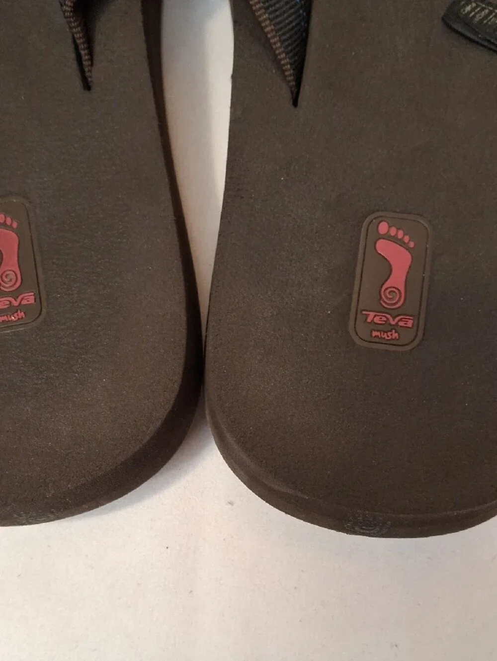 Teva Men's Brown Thong Flip Flops with Mauve and Orange Accents.Lightly Worn